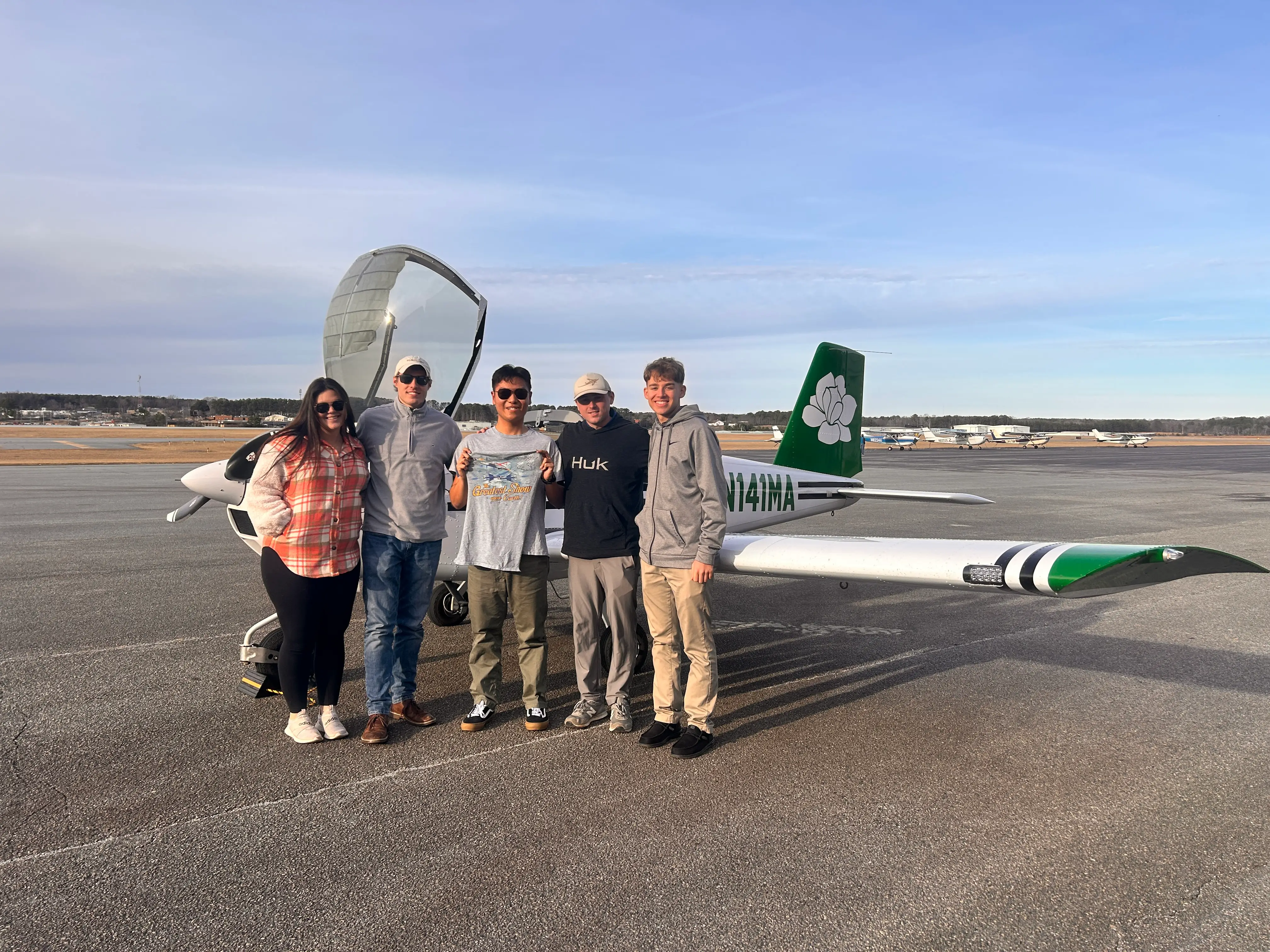 Magnolia Aviation Academy students with cfis group picture in front of aircraft