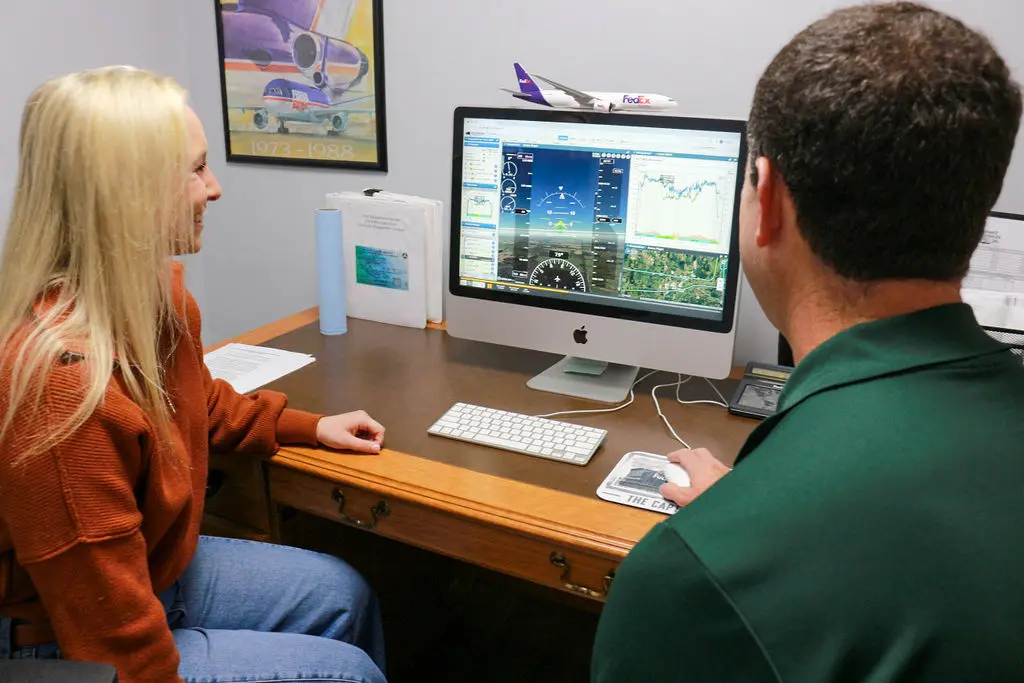 Magnolia Aviation flight training cohort students on the flight line