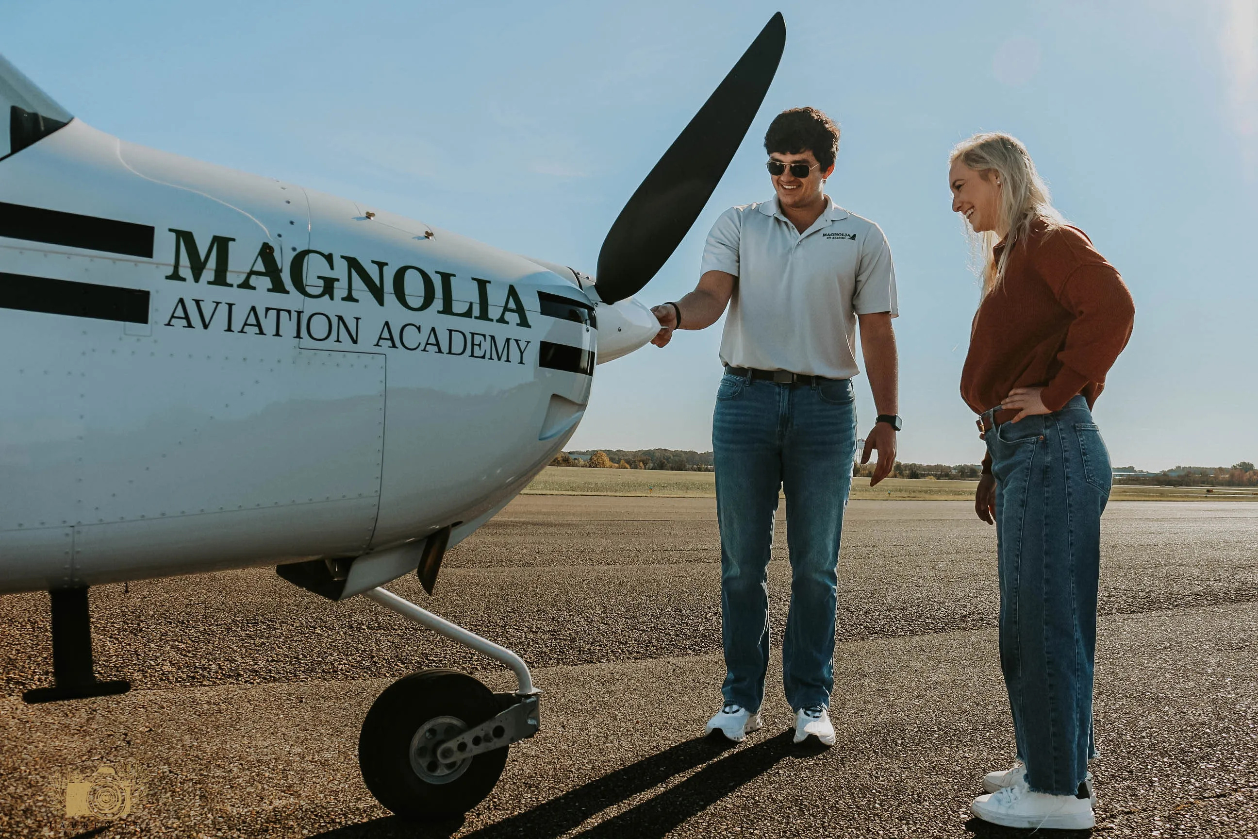 Magnolia Aviation Academy instructor and student beside a training aircraft