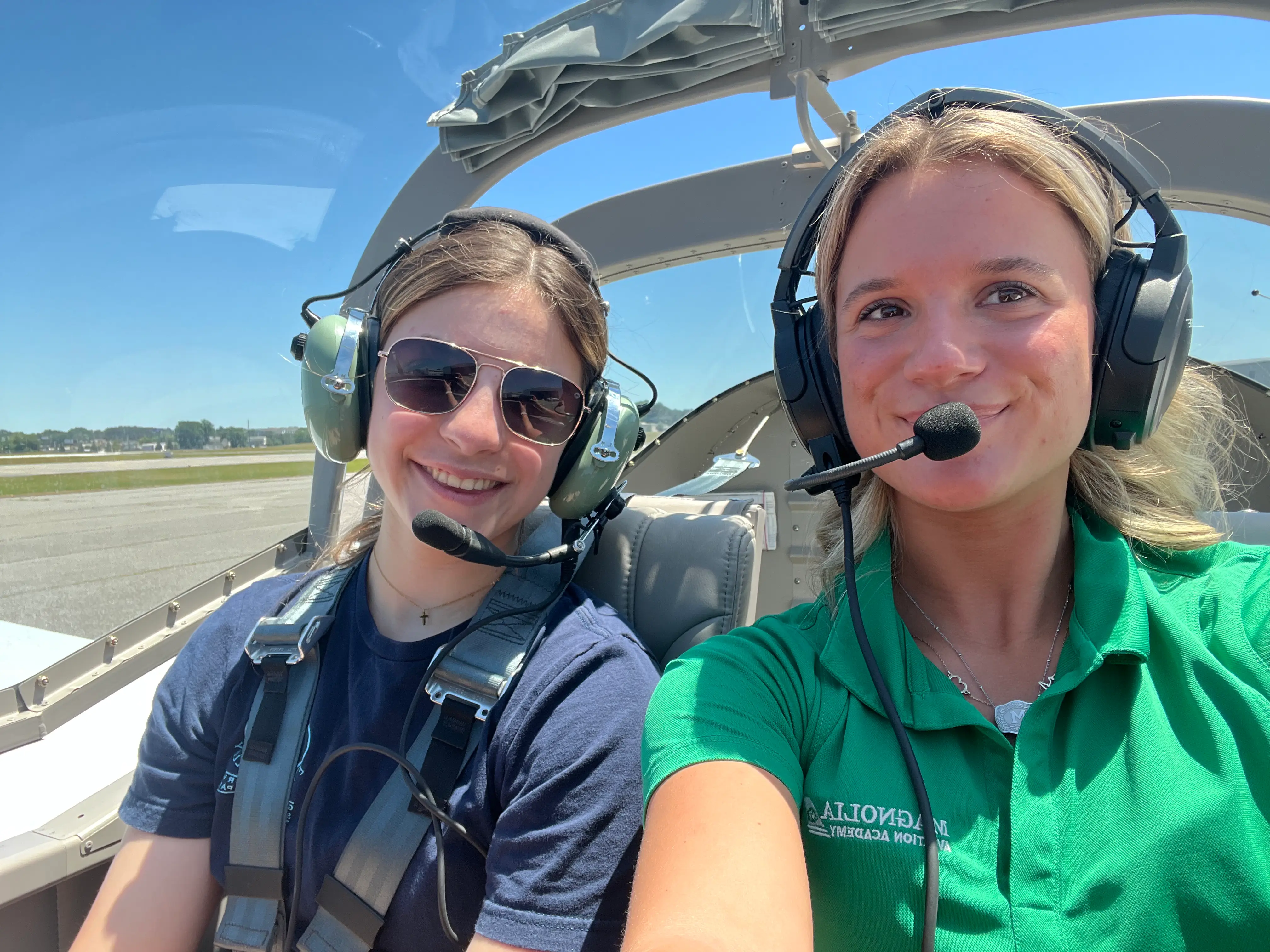 Magnolia Aviation Academy female cfi with female student selfie inside cockpit